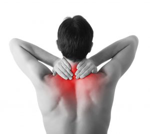 neck pain 300x268 - Rear view of a young man holding his neck in pain, isolated on w